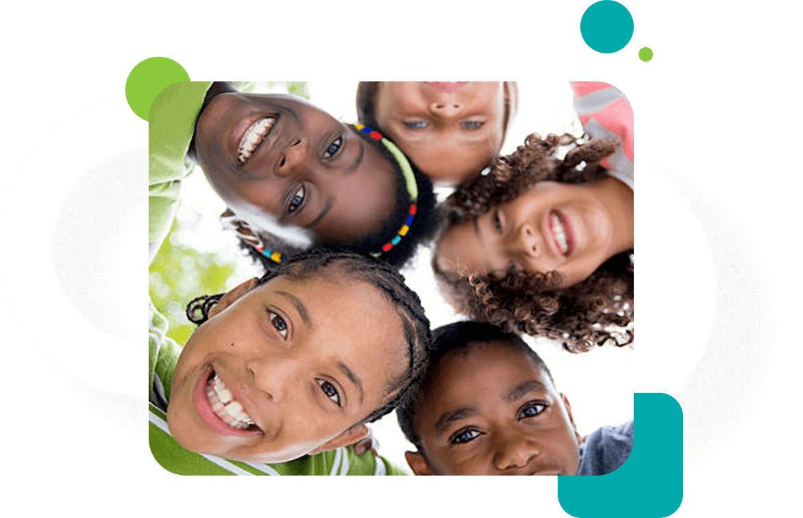 A group of children smiling for the camera.